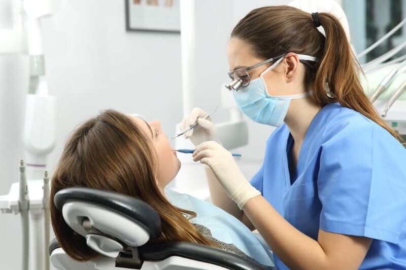 Dental patient getting periodontal cleaning