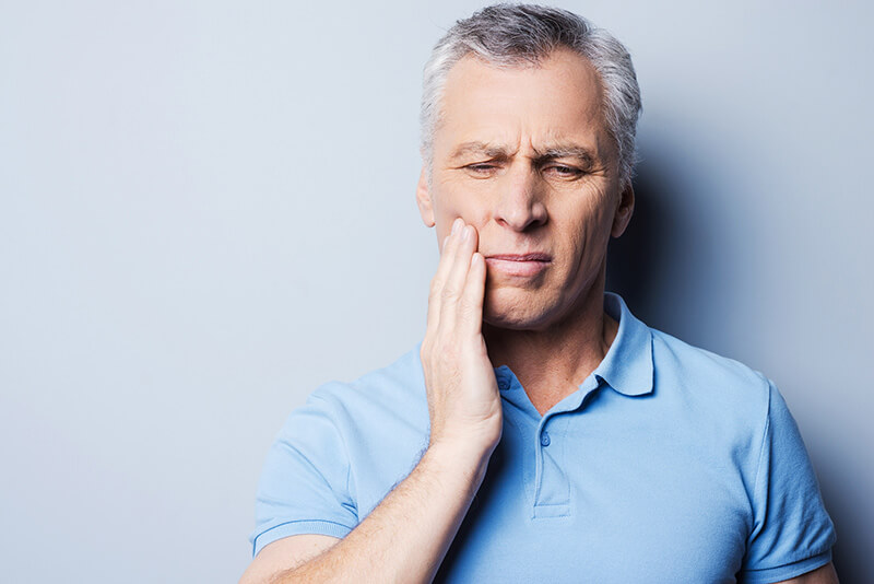 Man with painful tooth needing endodontics